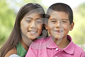 Portrait Of Brother And Sister In Park