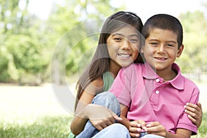 Portrait Of Brother And Sister In Park