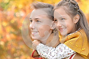 Portrait of brother and sister in park