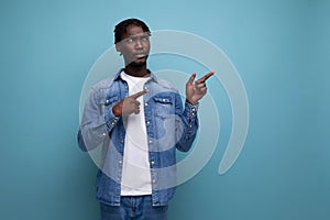 portrait of a brunet american young man with dreadlocks with a brilliant idea