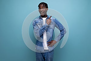 portrait of a brunet american young man with dreadlocks with a brilliant idea