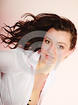 Portrait of brunette girl long hair on pink