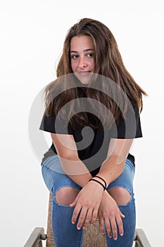 Portrait brunette girl long hairs sit on chair beautiful young woman on white background