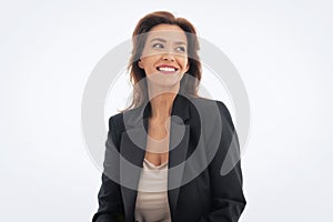 Portrait of brunette haired woman wearing black suit and cheerful smiling against isolated white background