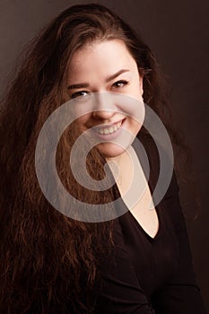 Portrait of a brunette with long curly hair