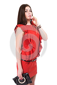 Portrait of brunette posing in red dress