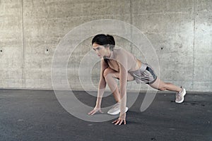 Portrait of a brunette, sensual lady doing the stretching
