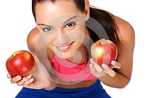 Portrait of a brunette teenager with apples