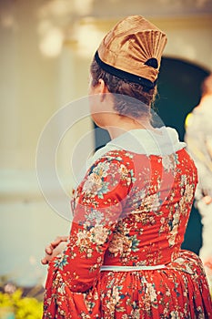 Portrait of brunette woman dressed in red historical Baroque clothes