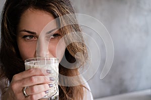 portrait of brunette woman girl in loft cafe. coffee break. lunch time. happy worker. business woman relax