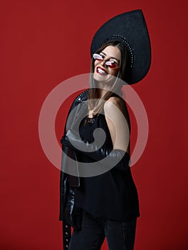 Portrait of brunette woman new fashion sunglasses and Russian traditional style kokoshnik hat