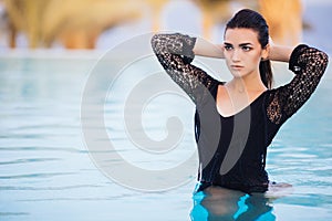 Portrait brunette woman relax luxury pool infinity sea relax and swim