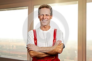 Portrait of builder with arms crossed.