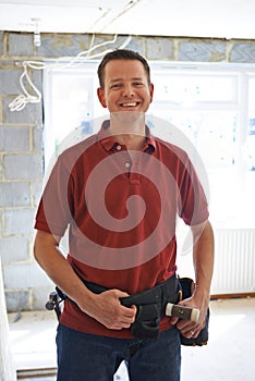 Portrait Of Builder Carrying Out Home Improvements photo