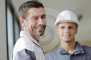 portrait builder in overalls and helmet on