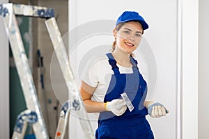 Portrait of builder in process of finishing work