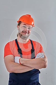 portrait of a builder on a wall background