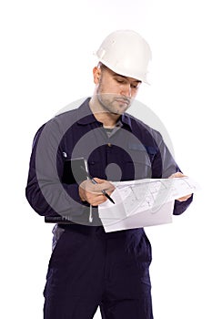 Portrait of a builder in a white helmet on a white