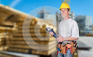 Portrait of building worker with tool belt and helmet