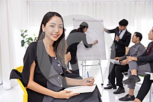 Portrait businee executive woman in office meeting room. Smart Asian lady young new generation leader photo