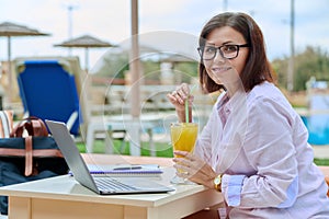 Portrait of business confident middle aged woman looking at camera