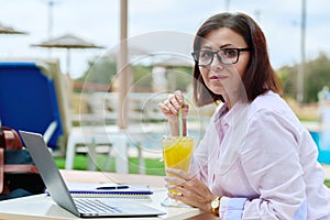 Portrait of business confident middle aged woman looking at camera