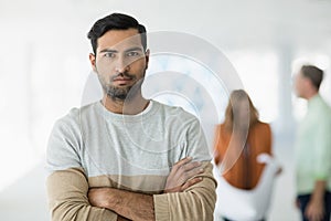 Portrait of business executive standing with arms crossed