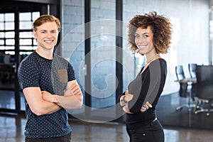 Portrait of business executives standing together in office