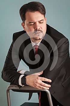 Portrait of business man, closed eyes and have unhappy look