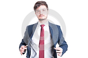 Portrait of business man closing his suit jacket