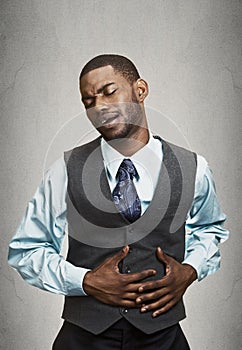 Portrait of a business man having stomach pain