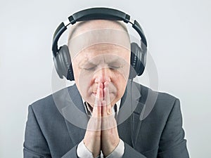 Portrait of a business man with headphones in relaxation listening to his favorite music