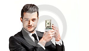 Portrait of a business man holding money