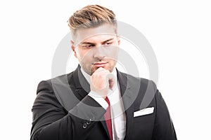 Portrait of business man making thinking gesture