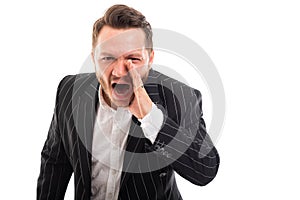 Portrait of business man screaming out loud