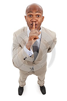 Portrait, business man and secret on lips in studio for surprise, privacy or confidential news on white background from