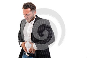 Portrait of business man showing stomach ache pain gesture