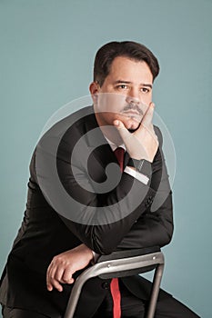 Portrait of business man thinks about something