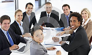 Portrait Of Business People Having Meeting In Office