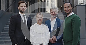 Portrait of Business People Standing at Street During Break