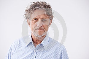 Portrait, business and senior man with confidence, employee and guy against studio background. Face, mature male person