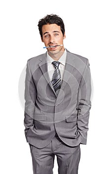 Portrait, business and suit with a young man, hands in pockets, in studio isolated on a white background. Corporate