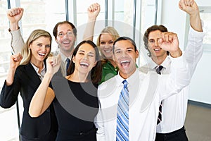 Portrait Of Business Team In Office Celebrating