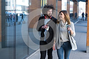 Portrait Of Business Team Outside Office. Meeting Concept. People Walking and drinking coffe, going to the office