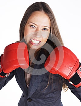 Portrait of business woman boxing in red gloves. business activity