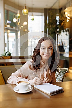 Portrait of a business woman in a cafe.
