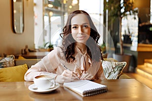 Portrait of a business woman in a cafe.