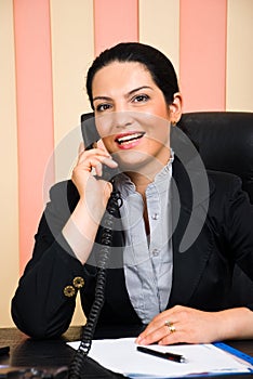 Portrait of business woman calling by telephone