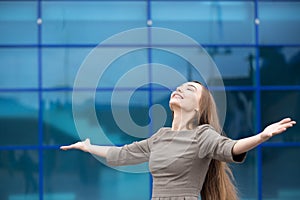 Portrait of business woman feeling happy with open arms. Copy sp