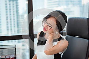 Portrait of Business Woman Having Shoulder Pain During Working in Office Workplace, Asian Woman is Suffering From Fatigue Office
